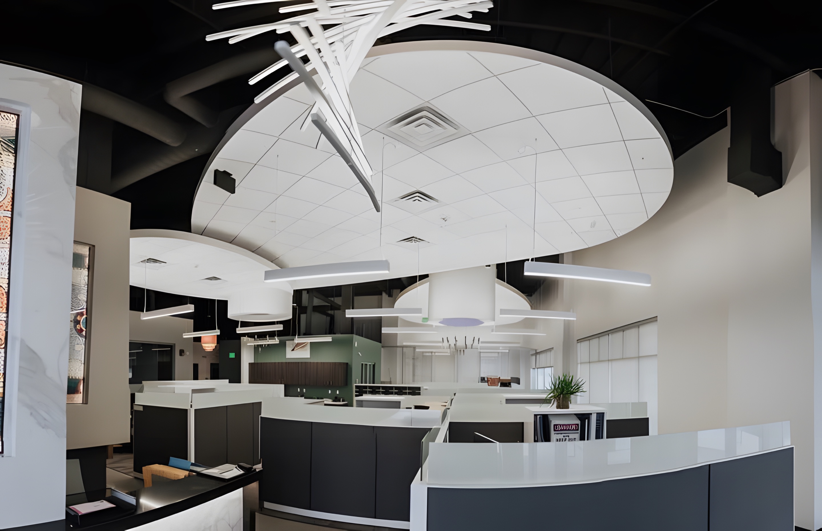 An office with sculpted ceiling fixtures and a suspended light sculpture